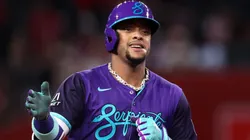 Ketel Marte #4 of the Diamondbacks gestures while running the bases after hitting a solo home run.