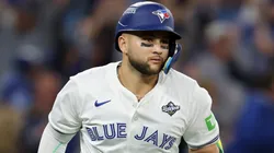 Bo Bichette #11 with the Blue Jays hits a three-run home run during the 2025 World Series.