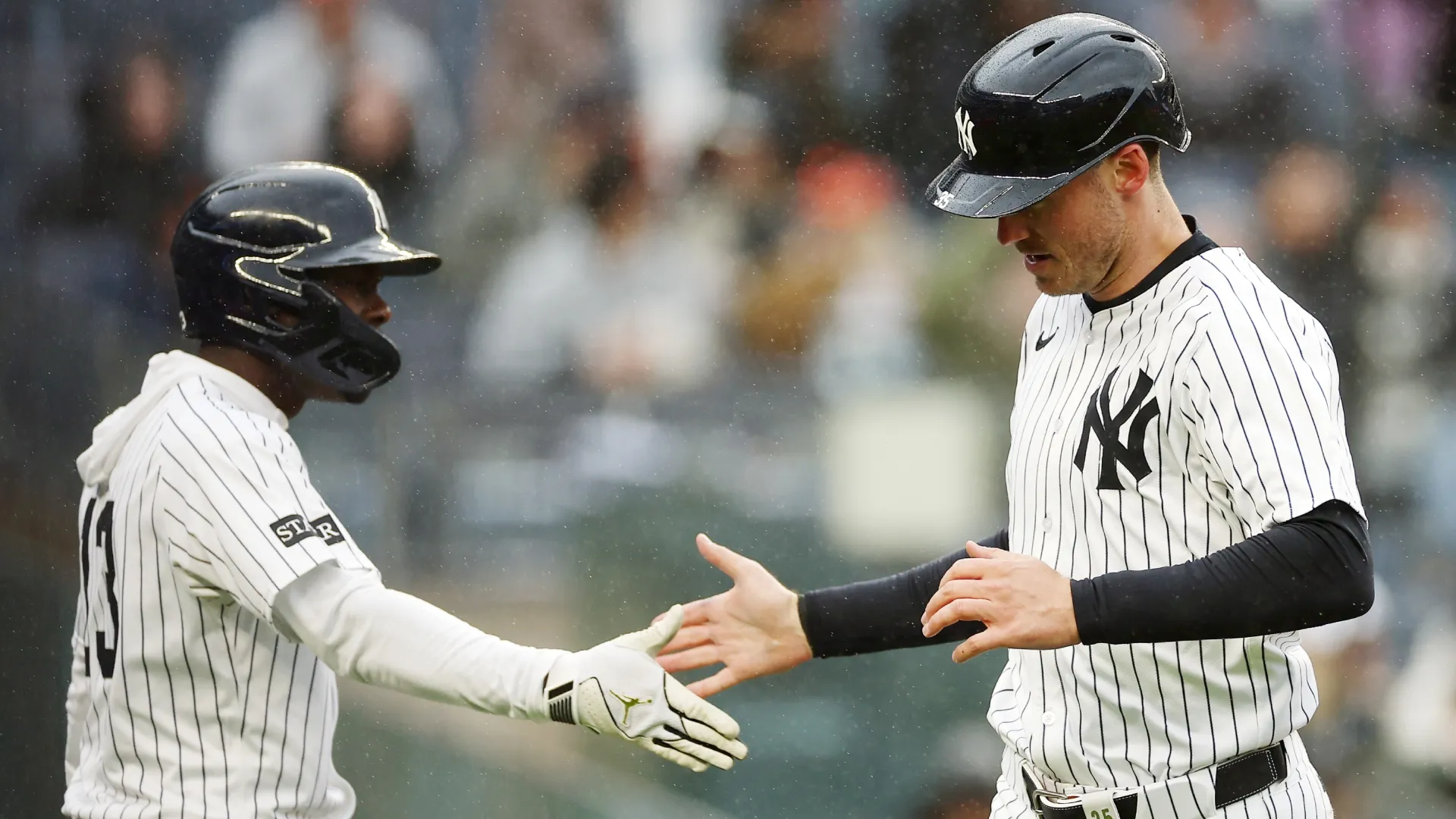 Cody Bellinger #35 celebrates with Jazz Chisholm Jr. #13 after scoring on a sacrifice fly. Sarah Stier/Getty Images
