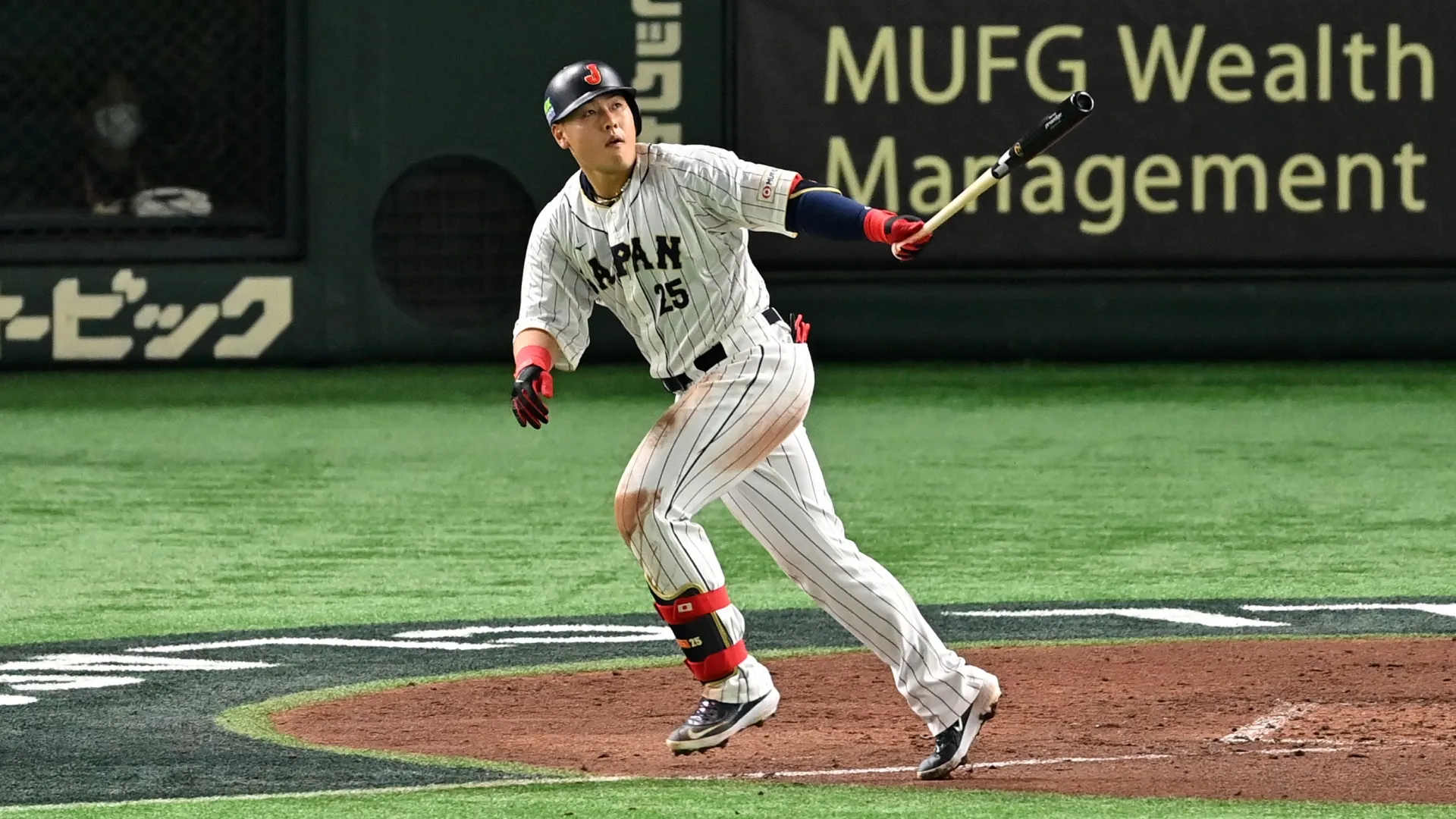 Kazuma Okamoto #25 of Japan celebrates hitting a home run during the World Baseball Classic. Kenta Harada/Getty Images