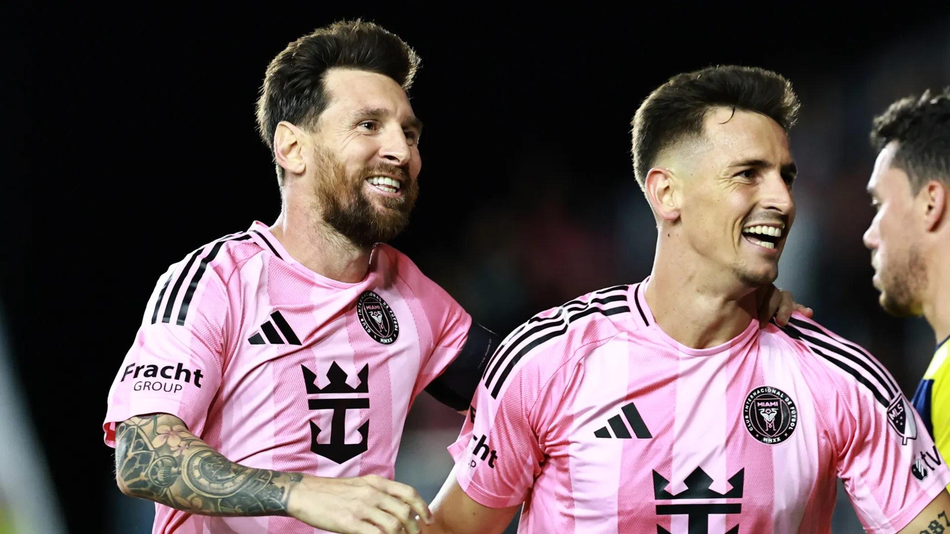 Lionel Messi and Tadeo Allende celebrate a goal