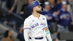 Bo Bichette #11 of the Toronto Blue Jays hits a three-run home run.