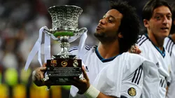 Marcelo Vieira of Real Madrid CF celebrates with the Spanish Super Cup trophy in 2012.