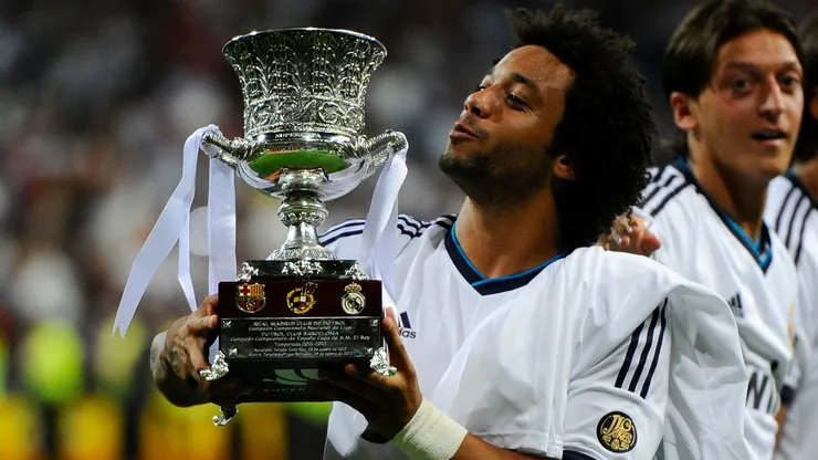 Marcelo Vieira of Real Madrid CF celebrates with the Spanish Super Cup trophy in 2012.