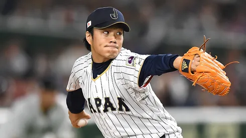Takahiro Norimoto #14 of Japan pitches.