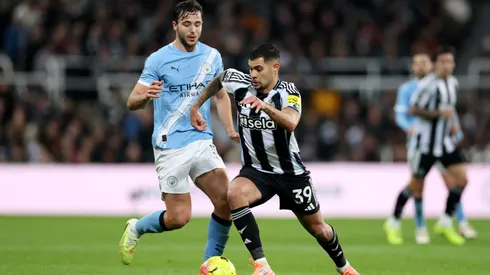 Bruno Guimaraes of Newcastle United is put under pressure by Nico Gonzalez of Manchester City.
