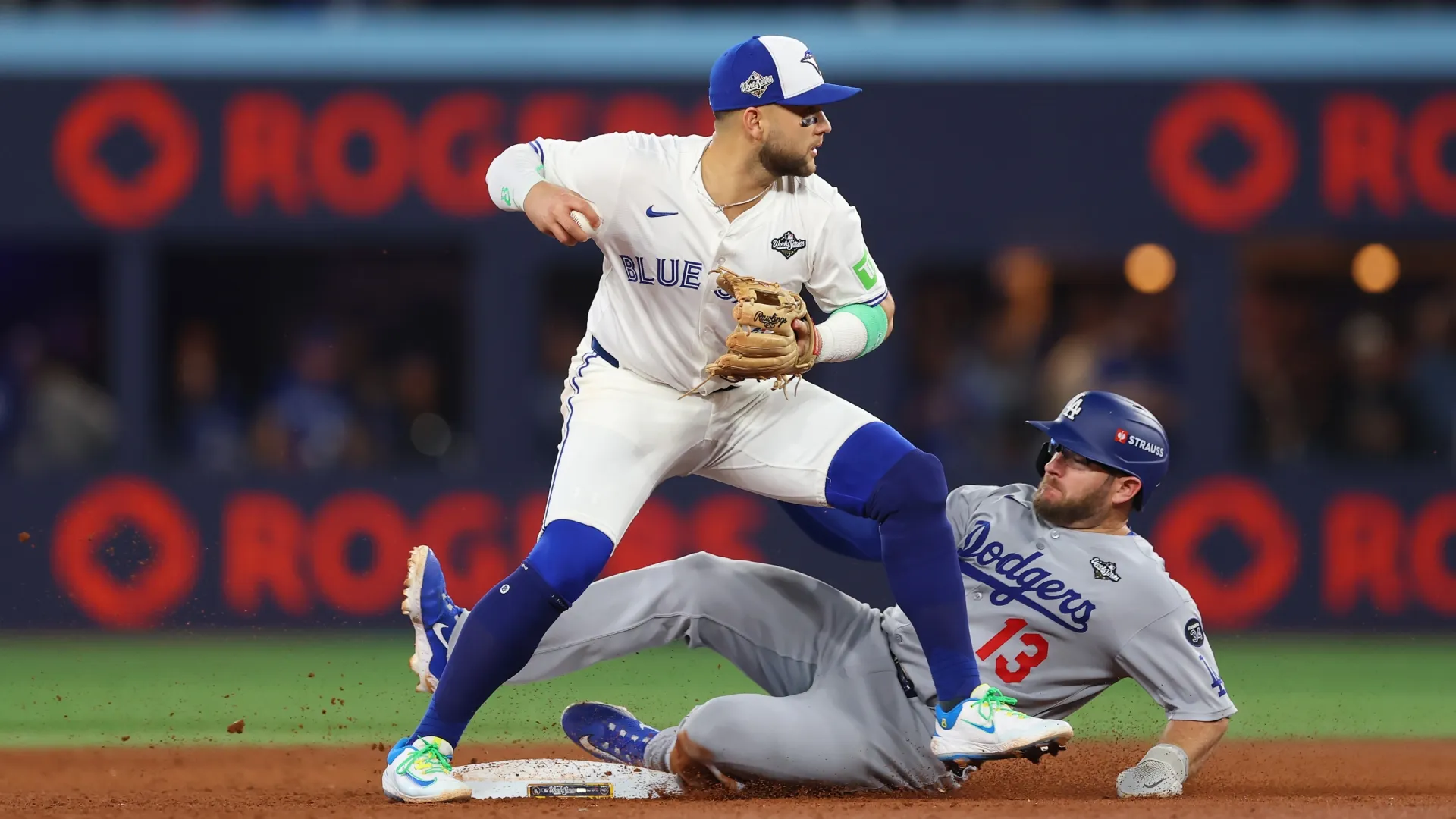 Bo Bichette #11 of the Blue Jays forces Max Muncy #13 of the Dodgers out. Gregory Shamus/Getty Images