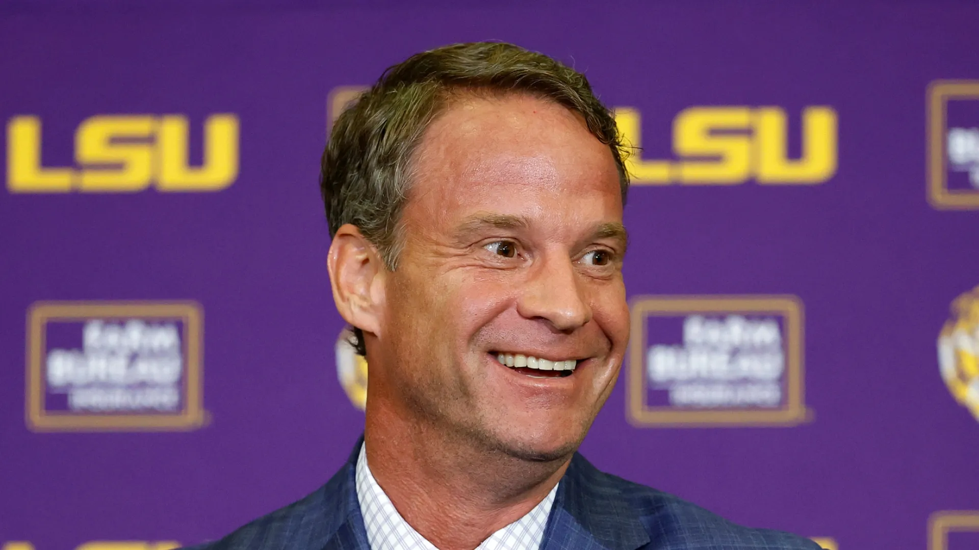 Lane Kiffin smiles