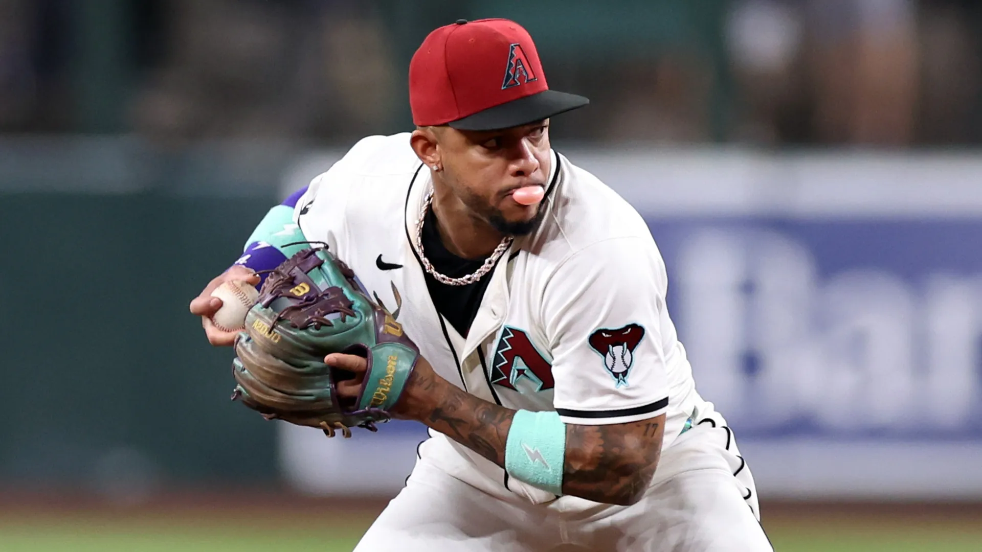 Ketel Marte #4 of the Diamondbacks turns a double play against the Giants. Chris Coduto/Getty Images