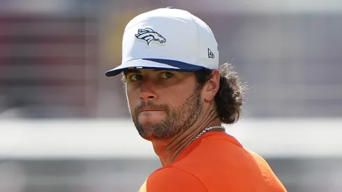 Jarrett Stidham warms up before a Broncos game.

