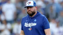 Manager John Schneider #14 of the Toronto Blue Jays walks to the dugout.