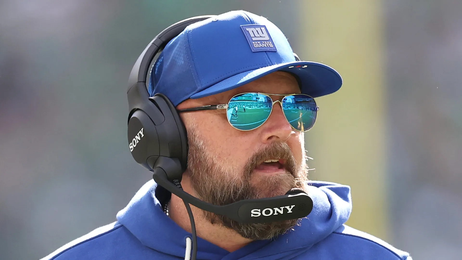 Brian Daboll with sunglasses and headset