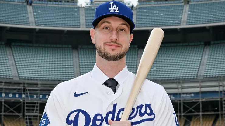 Kyle Tucker poses during his introductory press conference with the Dodgers.