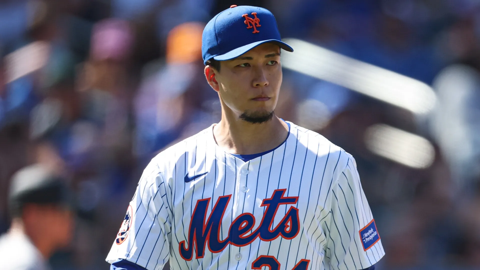 Kodai Senga throws during a bullpen session. Vincent Carchietta/Getty Images