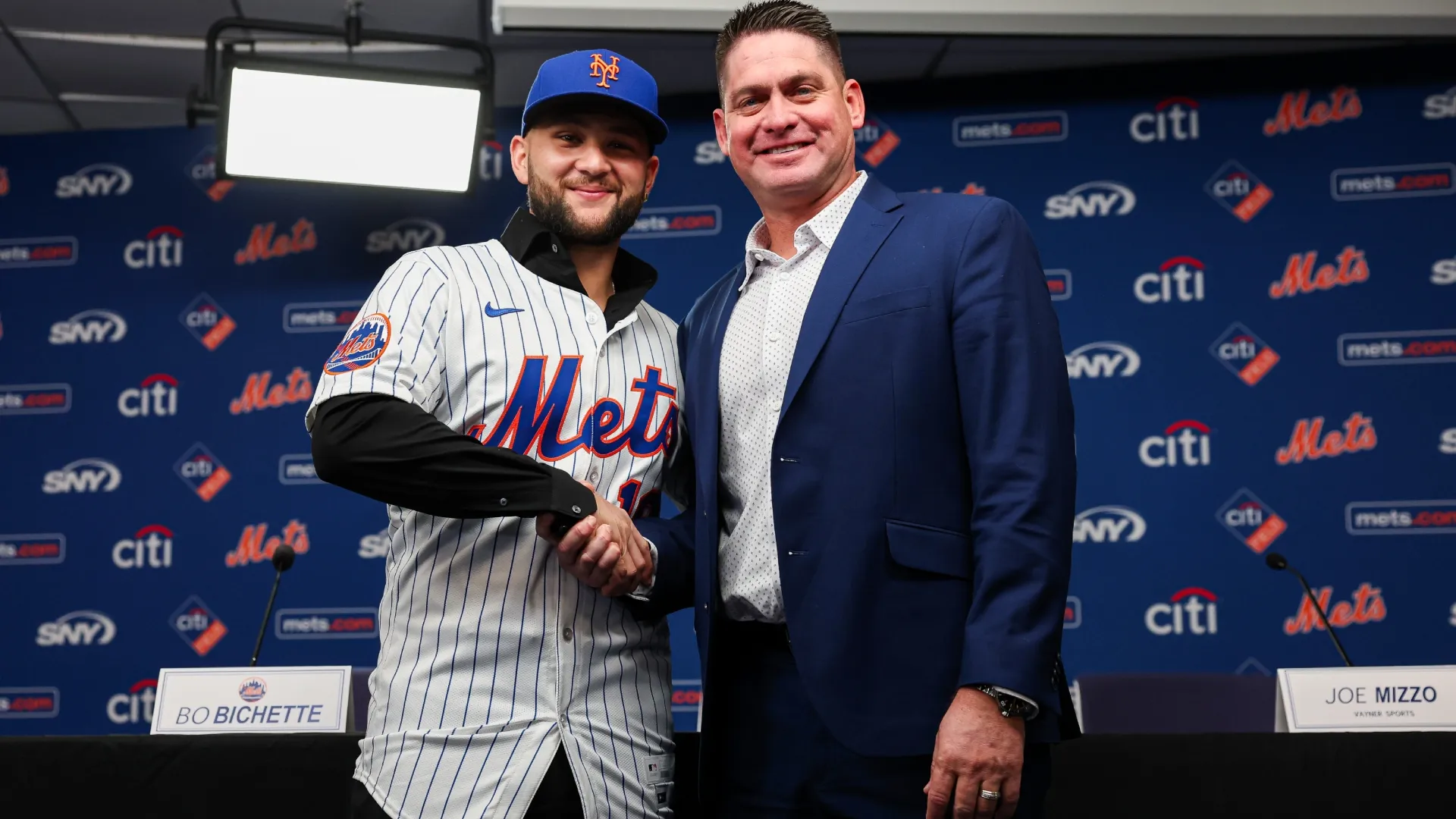 Bo Bichette #19 and Carlos Mendoza of the New York Mets pose for a photo during an introductory press conference. Ishika Samant/Getty Images)
