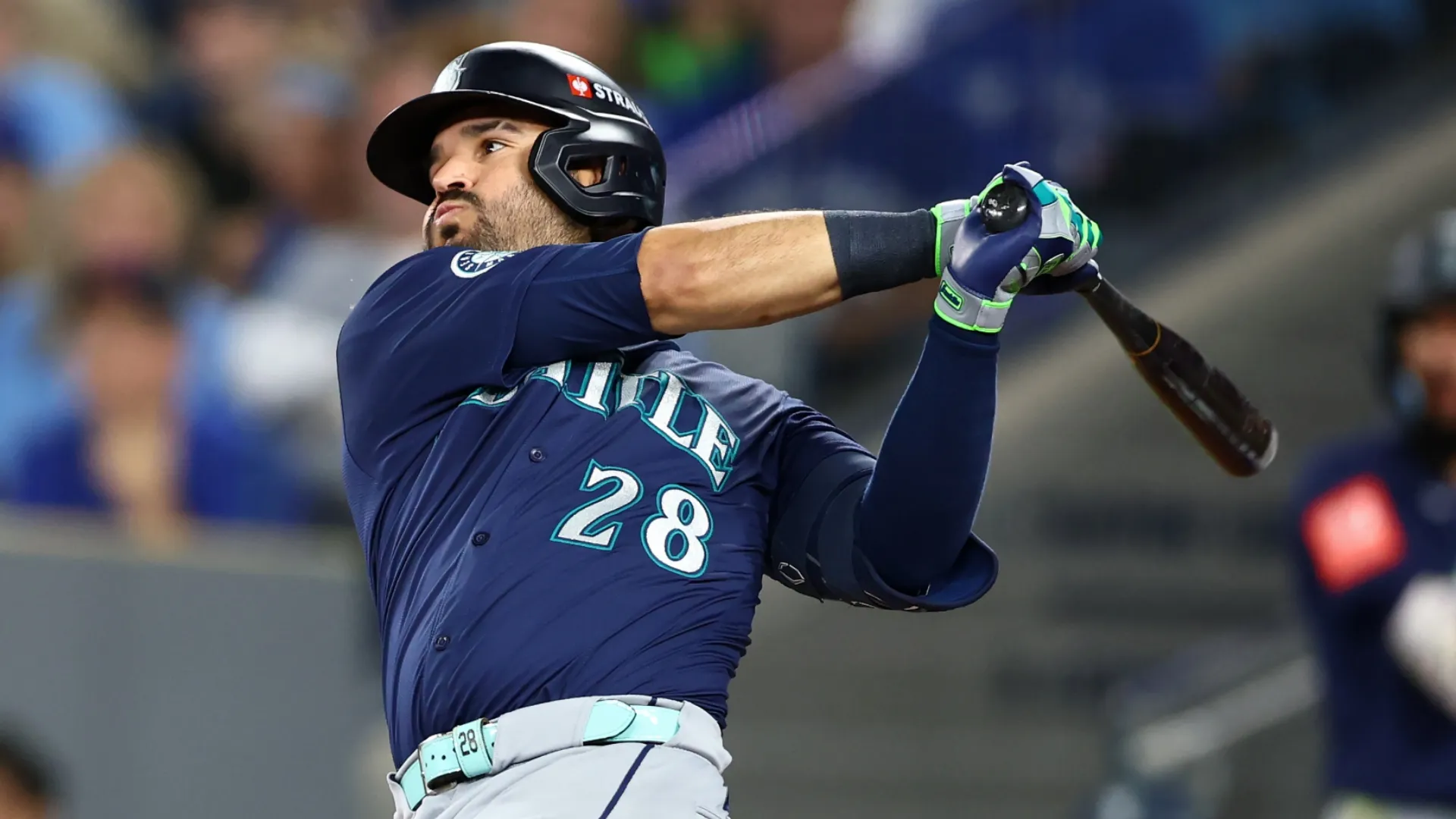 Eugenio Suarez #28 of the Mariners hits a single during the second inning against the Blue Jays. Vaughn Ridley/Getty Images
