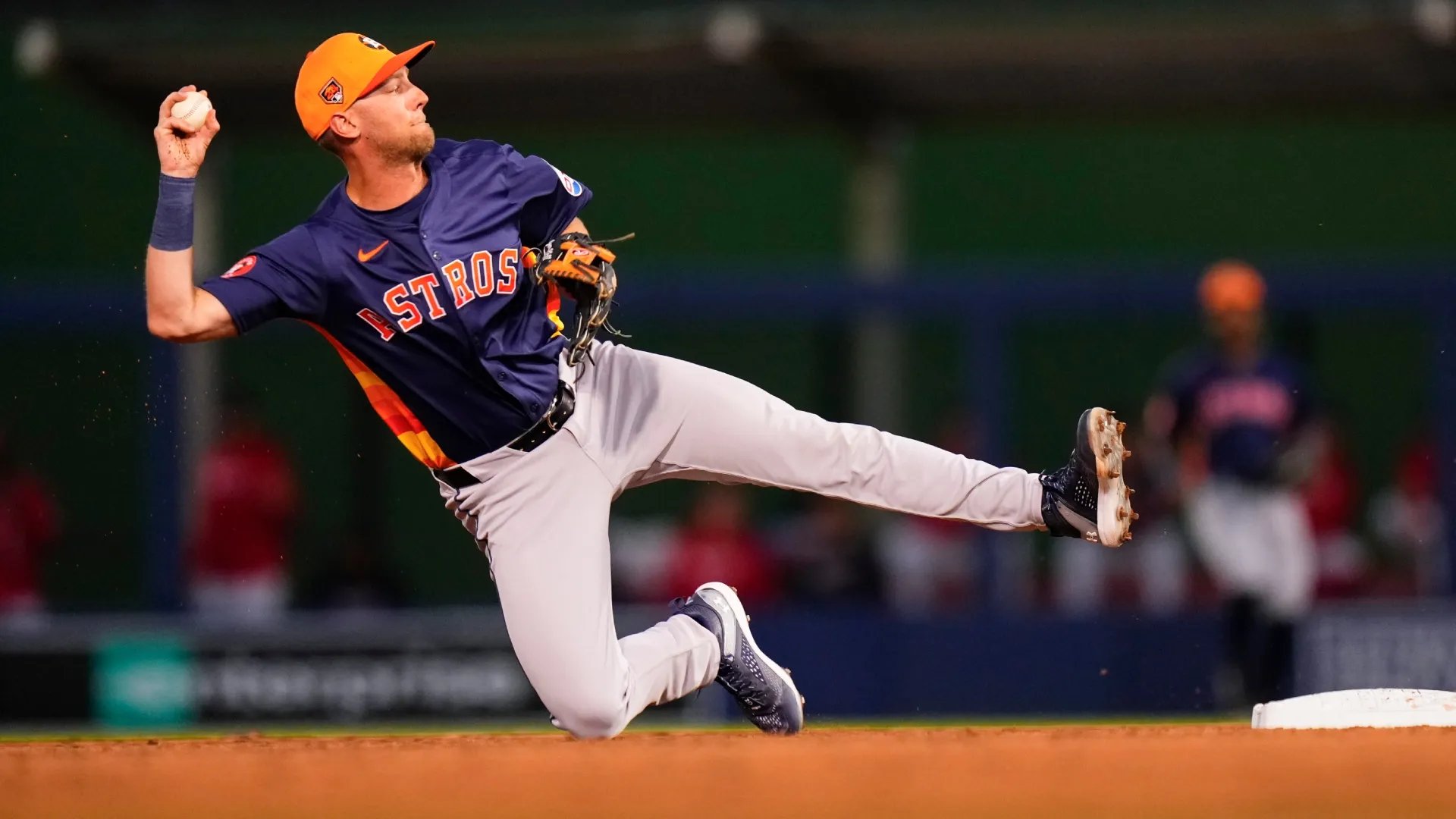 Grae Kessinger #16 of the Astros throws the ball to first base against the Nationals. Rich Storry/Getty Images