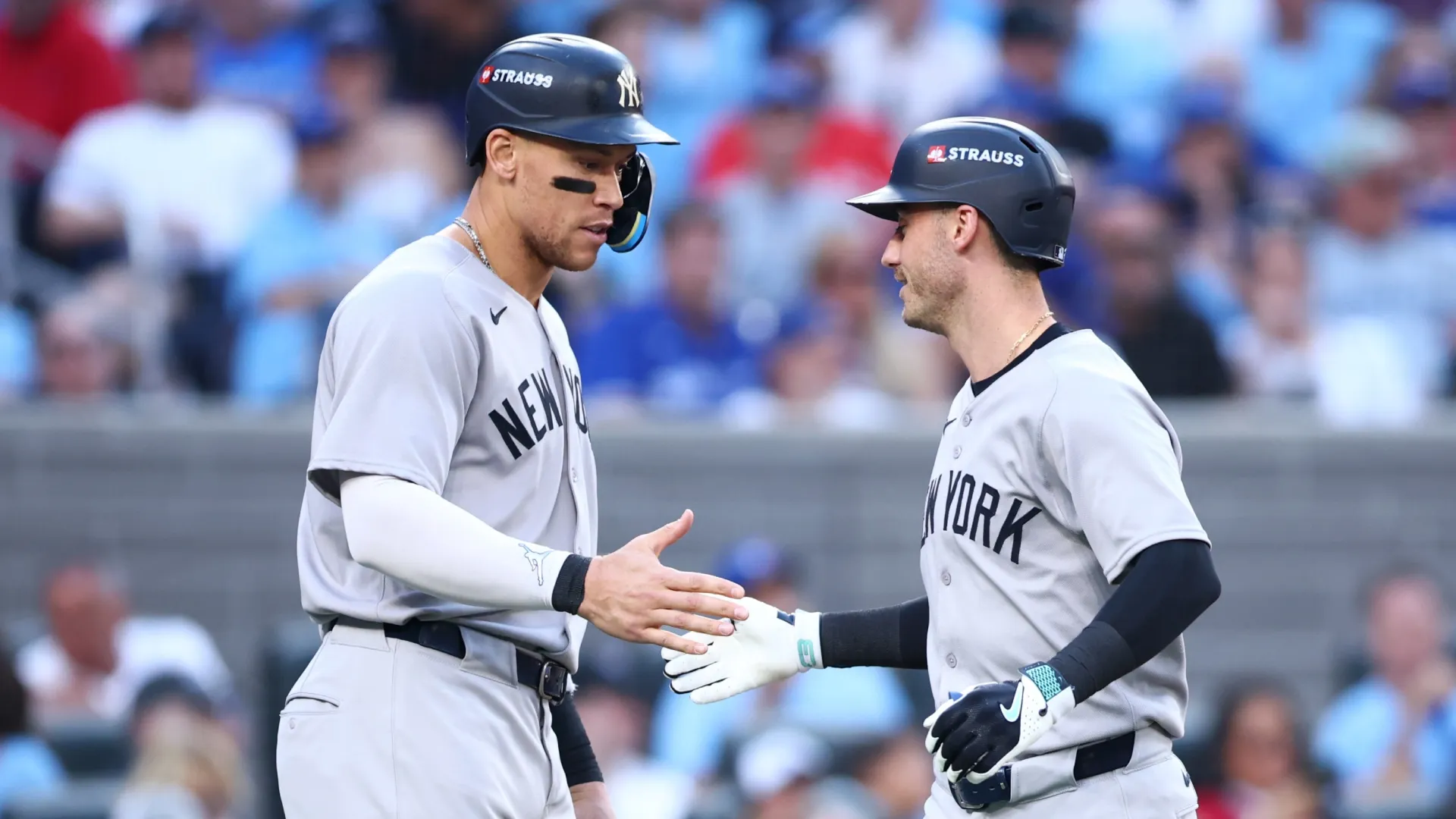 Aaron Judge #99 of the Yankees and Cody Bellinger #35 high five. Vaughn Ridley/Getty Images