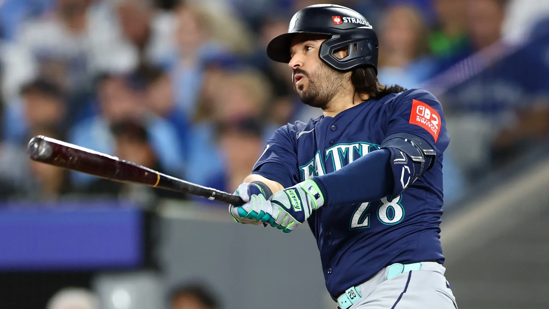 Eugenio Suarez #28 of the Mariners hits a single against the Blue Jays. Vaughn Ridley/Getty Images