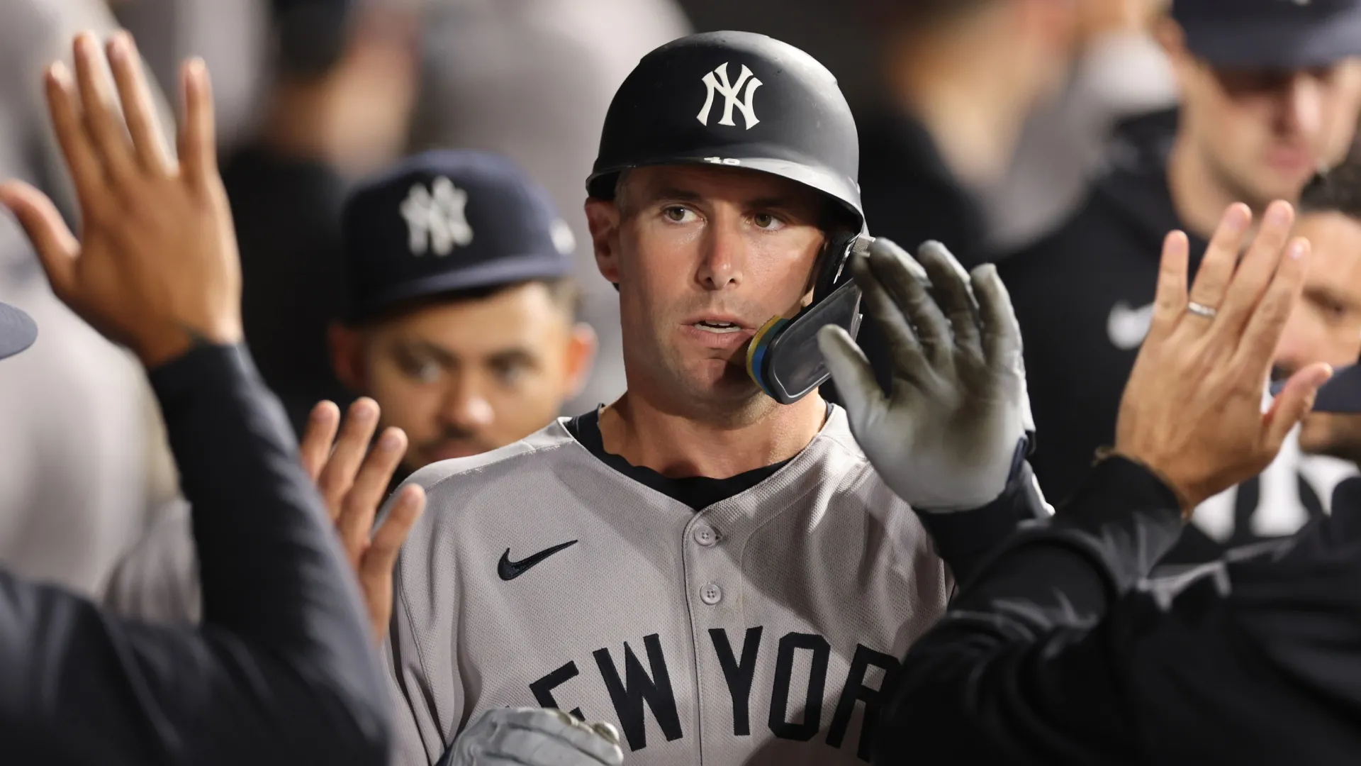 Paul Goldschmidt #48 of the Yankees high fives teammates after scoring a run. Michael Reaves/Getty Images