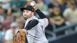 Casey Schmitt throws to first base on August 18, 2025 in San Diego.