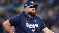 John Schneider #14 of the Toronto Blue Jays walks.