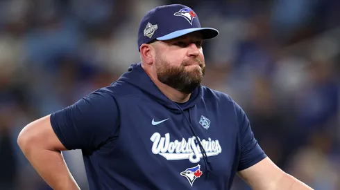 John Schneider #14 of the Toronto Blue Jays walks.