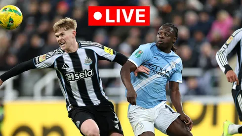 Lewis Hall of Newcastle United and Jeremy Doku of Manchester City.