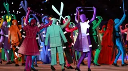 Actors dressed as a symbol of Italian fashion perform during the Winter Olympics opening ceremony.