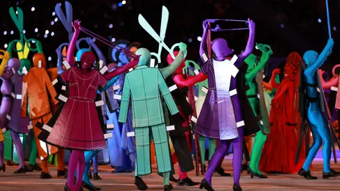Actors dressed as a symbol of Italian fashion perform during the Winter Olympics opening ceremony.