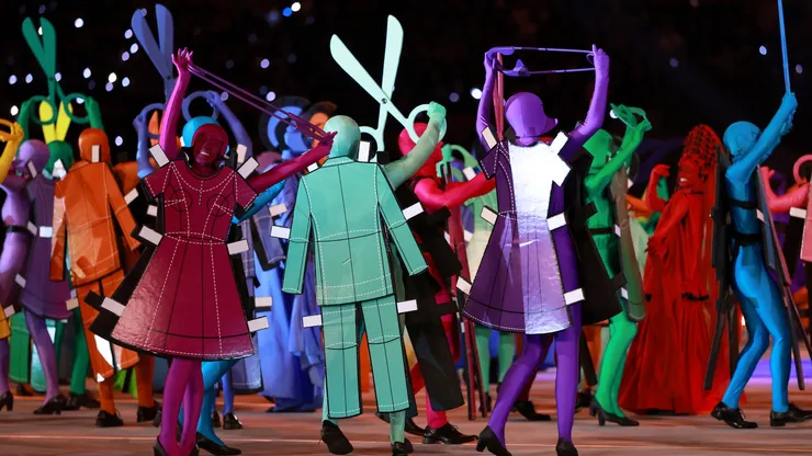 Actors dressed as a symbol of Italian fashion perform during the Winter Olympics opening ceremony.