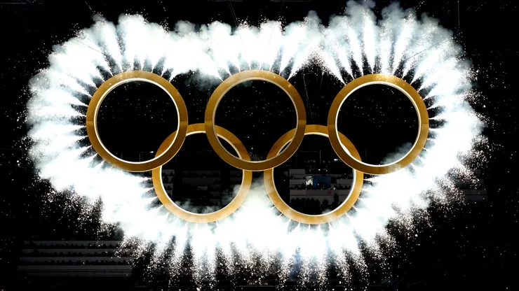 The Olympic rings come together as a fireworks display is seen during the opening ceremony of the Milano Cortina 2026 Winter Olympics.