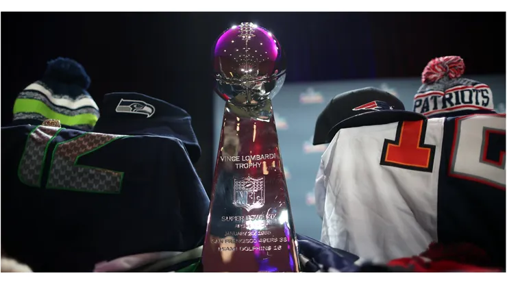 The Vince Lombardi Trophy with Seattle Seahawks and New England Patriots jerseys