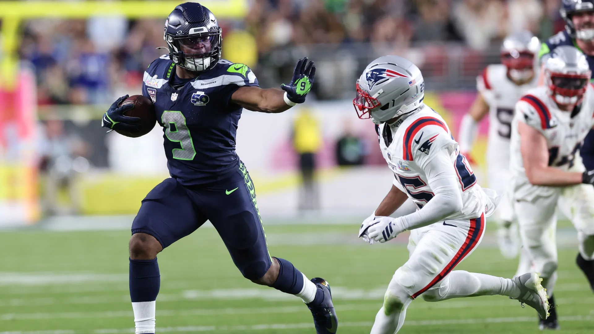 Kenneth Walker III of the Seahawks rushes against Marcus Jones during the Super Bowl (Source: Kevin C. Cox/Getty Images)