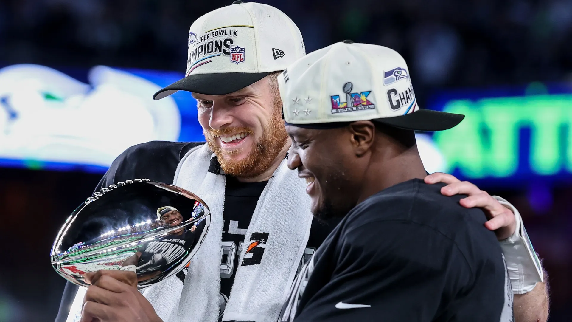 Sam Darnold and Kenneth Walker III celebrate with the Vince Lombardi Trophy (Source: Kevin C. Cox/Getty Images)