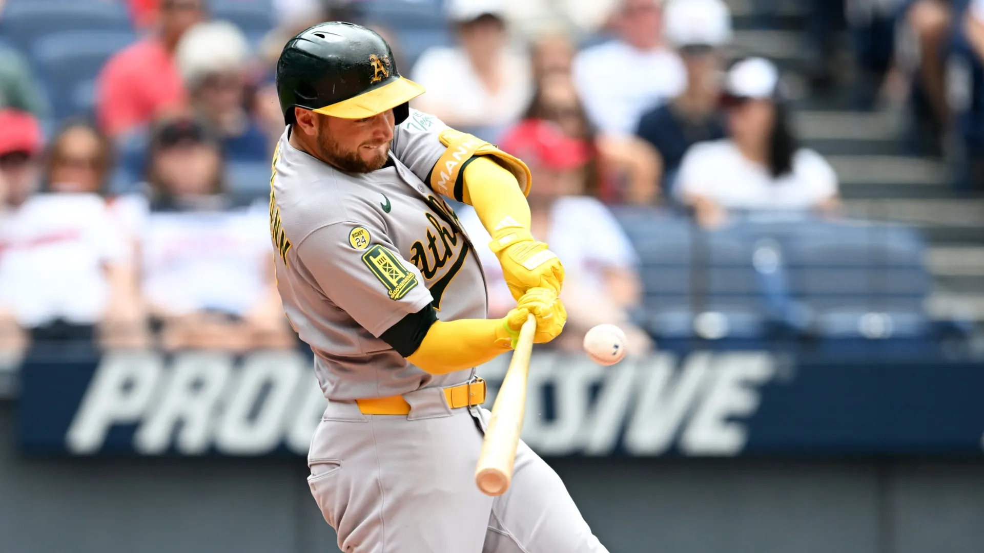 Max Schuemann #12 of the Athletics hits a single. Nick Cammett/Getty Images