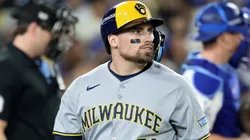Caleb Durbin #21 with the Brewers walks back to the dugout.