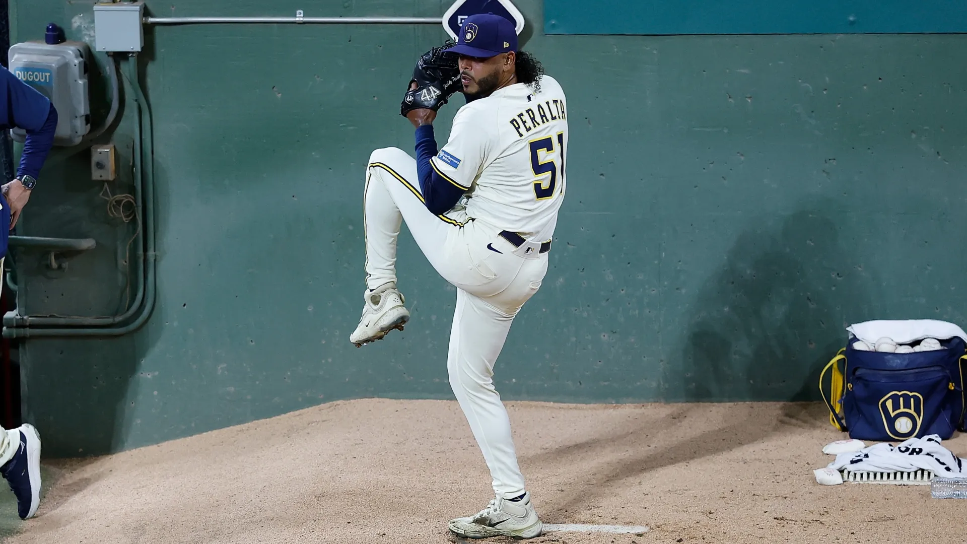 Freddy Peralta #51 with the Milwaukee Brewers throws in the bullpen. John Fisher/Getty Images