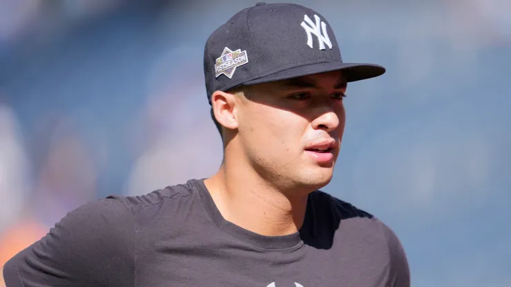 Anthony Volpe #11 of the Yankees warms up before game two against the Blue Jays.