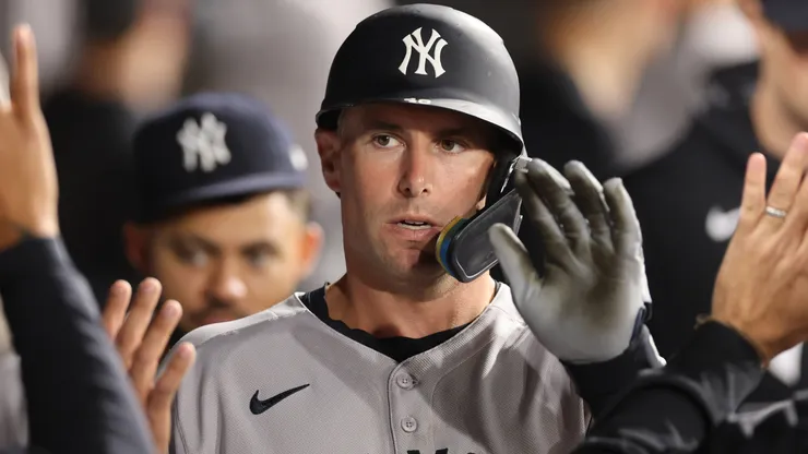 Paul Goldschmidt #48 of the New York Yankees high fives teammates.