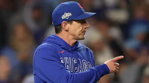 Manager Craig Counsell #11 of the Chicago Cubs makes a pitching change.