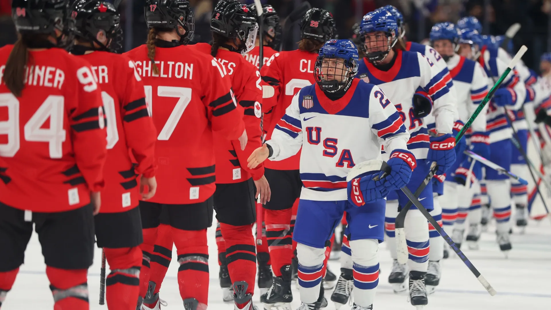 Kendall Coyne of Team United States shakes hands with players of Canada at the 2026 Winter Olympic games (Source: Gregory Shamus/Getty Images)