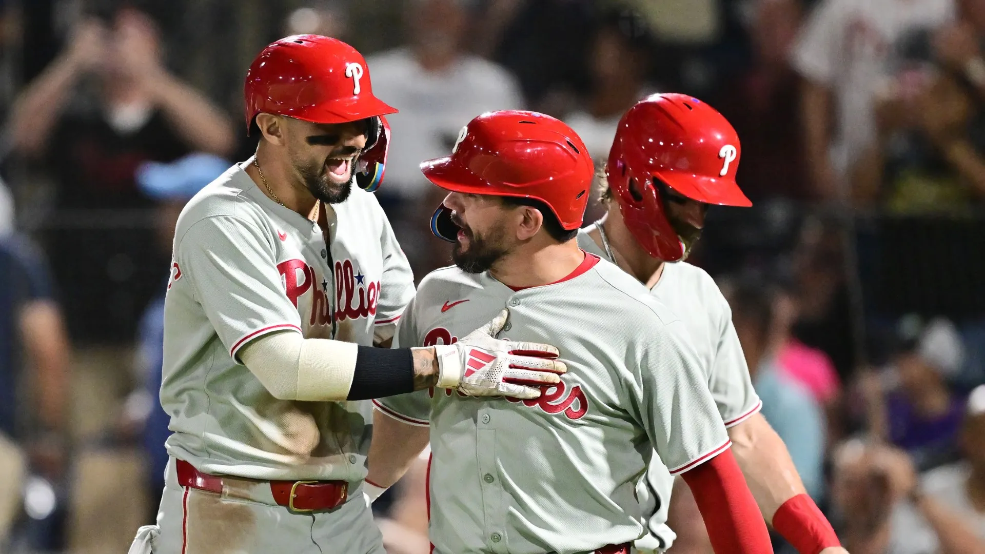 TAMPA, FLORIDA – MAY 06: Nick Castellanos #8 of the Philadelphia Phillies celebrates with teammates Kyle Schwarber #12 and Bryce Harper #3 after hitting a three-run home run in the eighth inning against the Tampa Bay Rays at George M. Steinbrenner Field on May 06, 2025 in Tampa, Florida. (Photo by Julio Aguilar/Getty Images)
