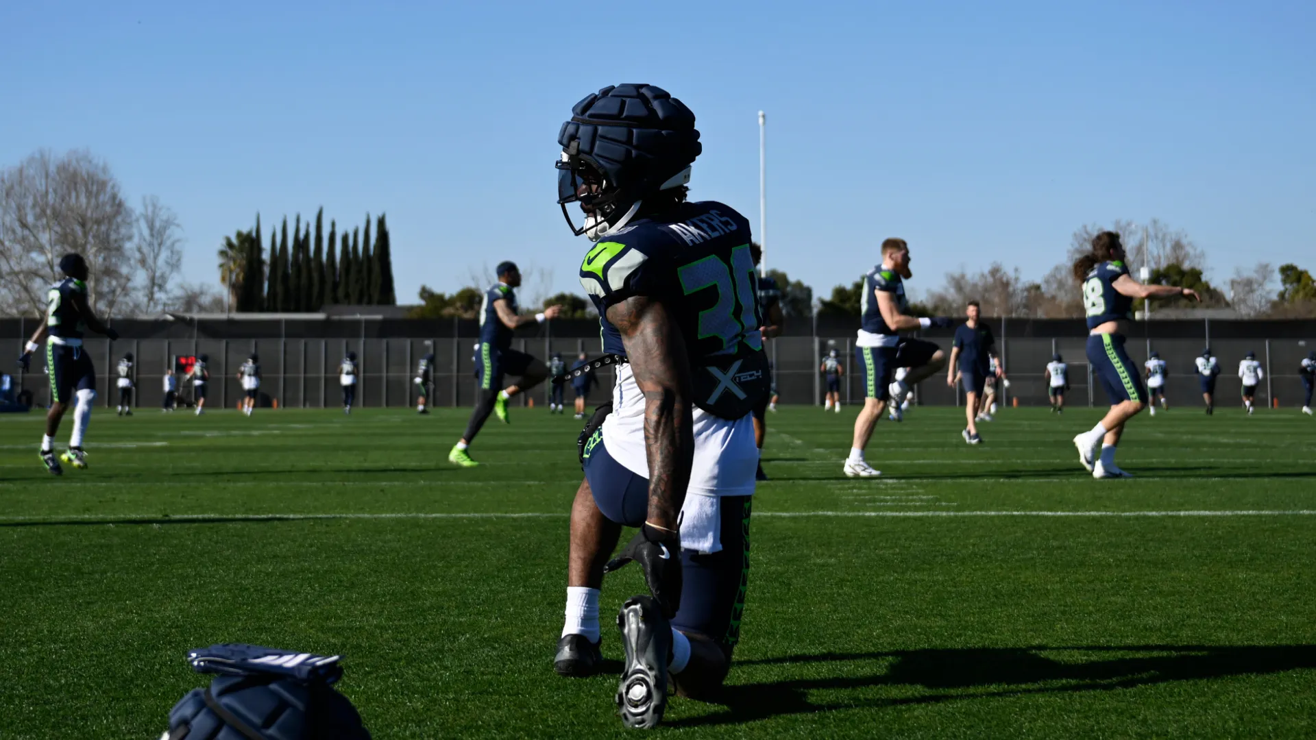 Cam Akers of the Seattle Seahawks stretches during a practice ahead of Super Bowl LX. (Getty Images)