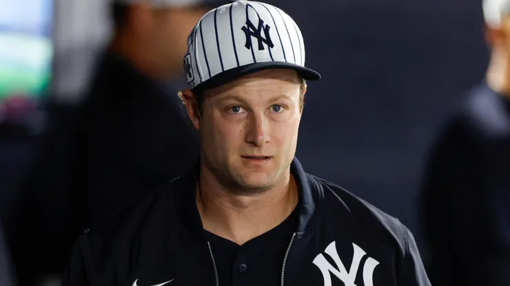 Gerrit Cole #45 of the Yankees walks through the dugout.