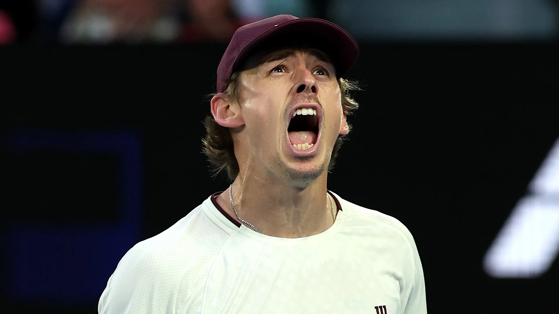 Alex de Minaur celebrating winning a match