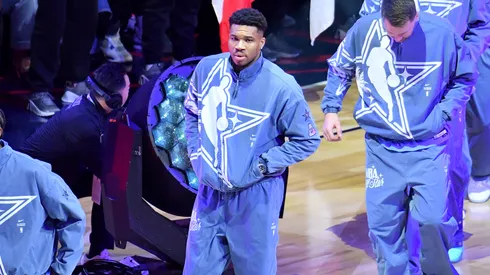 Giannis Antetokounmpo #34 of the Milwaukee Bucks and Team World walks onto the court.