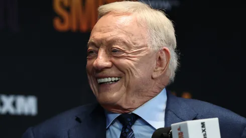 Jerry Jones speaks as Stephen A. Smith broadcasts.