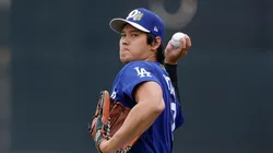 Shohei Ohtani #17 of the Los Angeles Dodgers participates in a throwing drill.