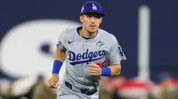 Tommy Edman #25 of the Los Angeles Dodgers warms up.